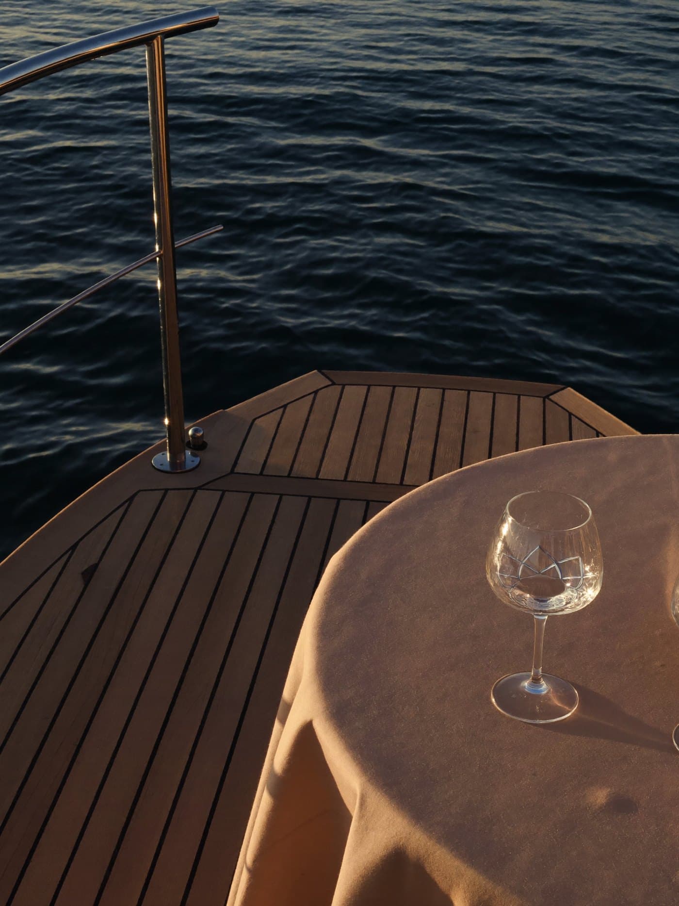 The teak deck of a yacht at golden hour on Biscayne Bay